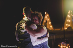 Indian groom dancing with his mother capture Indian groom dancing with his mother capture