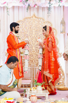 Indian bride and groom about to place garlands Indian bride and groom about to place garlands