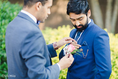 Indian groom being assisted by special guest Indian groom being assisted by special guest