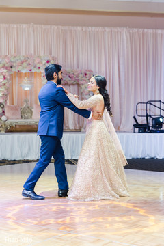 Indian bride and groom dancing Indian bride and groom dancing
