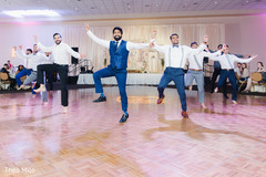 Indian groom and groomsmen performing Indian groom and groomsmen performing