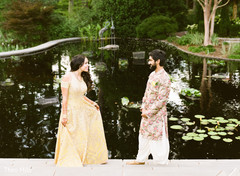 Indian bride and groom posing for pictures Indian bride and groom posing for pictures