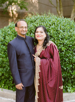 Parents posing for pictures Parents posing for pictures