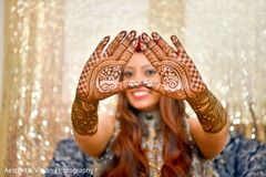 Indian bride showing her mehndi design Indian bride showing her mehndi design