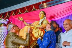 Indian bride being lifted by special guests Indian bride being lifted by special guests