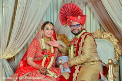 Indian bride and groom looking at the camera Indian bride and groom looking at the camera