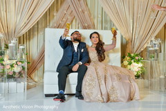 Indian bride and groom making a toast Indian bride and groom making a toast