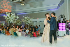 Indian bride and groom having their first dance Indian bride and groom having their first dance