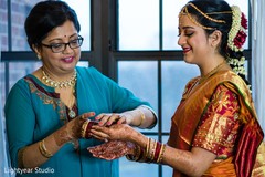 Indian bride being assisted by special guest Indian bride being assisted by special guest