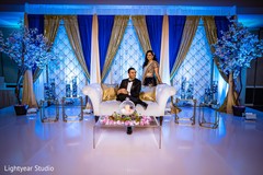 Indian bride and groom posing for pictures Indian bride and groom posing for pictures