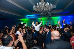 Groom being lifted by special guests Groom being lifted by special guests