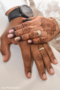 Indian couple showing their wedding rings. Indian couple showing their wedding rings.