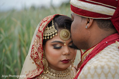 Lovely Indian groom kissing bride photo session. Lovely Indian groom kissing bride photo session.