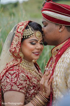 Lovely kiss capture of Indian bride and groom. Lovely kiss capture of Indian bride and groom.