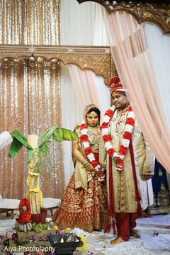 Indian groom guiding bride on seven steps ritual. Indian groom guiding bride on seven steps ritual.