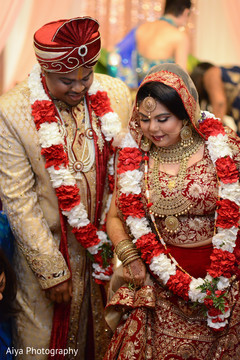 Indian bride stepping on nuts ritual. Indian bride stepping on nuts ritual.