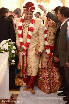 Indian bride and groom walking out of ceremony. Indian bride and groom walking out of ceremony.