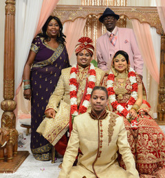 Dazzling indian couple with family portrait Dazzling indian couple with family portrait