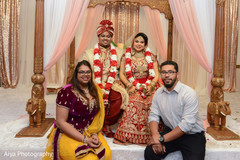 Dazzling indian couple with family . Dazzling indian couple with family .