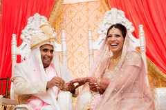 Indian bride and groom exchanging rings Indian bride and groom exchanging rings