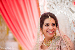 Indian bride smiling during the ceremony Indian bride smiling during the ceremony