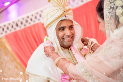 Indian groom receiving the garland from Maharani Indian groom receiving the garland from Maharani