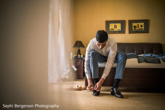 Indian groom putting his shoes on. Indian groom putting his shoes on.