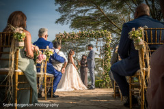 Indian couple making their bows at ceremony. Indian couple making their bows at ceremony.