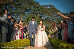 Indian bride and groom walking out of wedding ceremony. Indian bride and groom walking out of wedding ceremony.