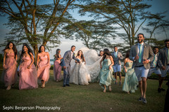 Joyful indian bride and groom with bridesmaids and groomsmen capture Joyful indian bride and groom with bridesmaids and groomsmen capture