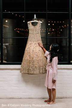 Maharani admiring her reception wedding dress. Maharani admiring her reception wedding dress.