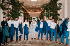 Indian groomsmen putting their reception coats. Indian groomsmen putting their reception coats.