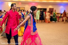 Lovely Indian couple during sangeet dance capture. Lovely Indian couple during sangeet dance capture.