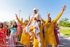 Indian groomsmen lifting up the groom at baraat celebration. Indian groomsmen lifting up the groom at baraat celebration.