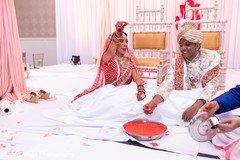 Indian bride got the ring from pot. Indian bride got the ring from pot.