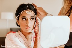 Maharani putting her tikka on. Maharani putting her tikka on.