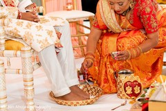 Washing Indian groom's foot with water ritual. Washing Indian groom's foot with water ritual.