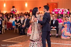 Indian bride and groom dancing at reception. Indian bride and groom dancing at reception.