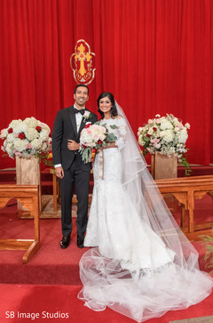 Indian couple posing at ceremony altar. Indian couple posing at ceremony altar.