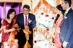 Indian wedding parents lighting up the sacred fire. Indian wedding parents lighting up the sacred fire.