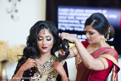 Indian bride being assisted by special guest Indian bride being assisted by special guest