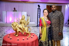 Indian bride and groom posing for pictures Indian bride and groom posing for pictures