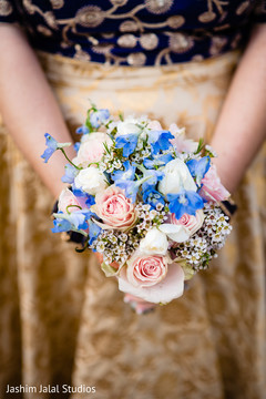Indian bridesmaid holding the bouquet Indian bridesmaid holding the bouquet