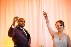 Indian bride and groom making a toast Indian bride and groom making a toast