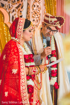 Indian groom reading his vows Indian groom reading his vows