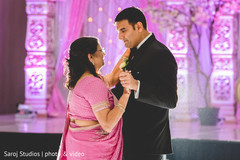 Indian groom dancing with his mother Indian groom dancing with his mother