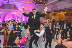 indian groom being lifted by special guest indian groom being lifted by special guest