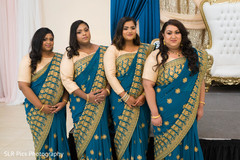 Bridesmaids posing for pictures Bridesmaids posing for pictures