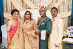 Bride and groom posing with family members Bride and groom posing with family members