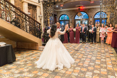 Indian bride dancing as guests observe Indian bride dancing as guests observe